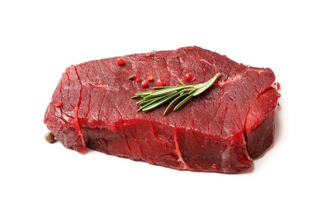 Tasty raw steak isolated on white background