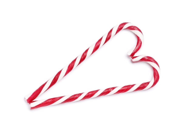 Tasty red candy cane  on white background. Festive treat