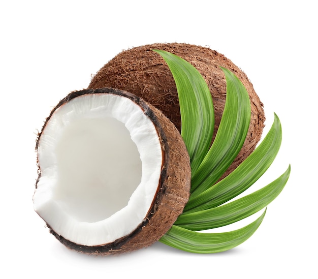 Tasty ripe coconuts and green leaves on white background