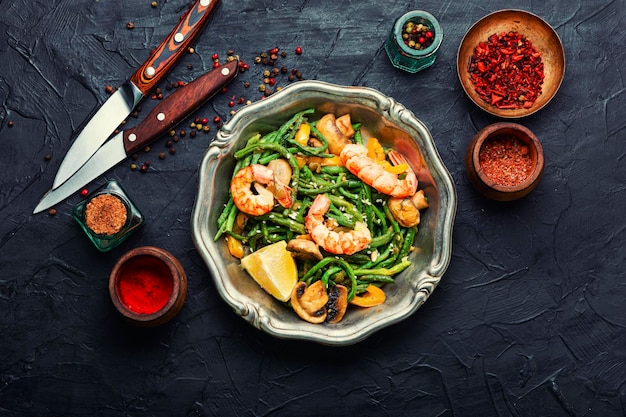 Tasty salad with seafood and vegetables