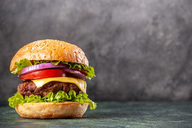 Tasty sandwich on the right side on gray ice surface with free space