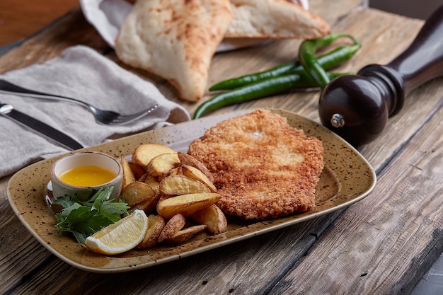 Tasty schnitzel with boiled potato Top view flat lay food