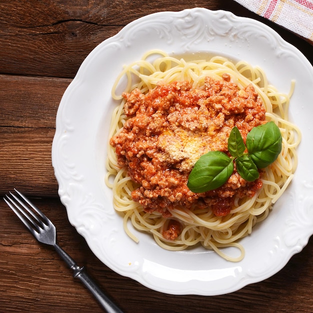 Tasty spaghetti with cheese and basil