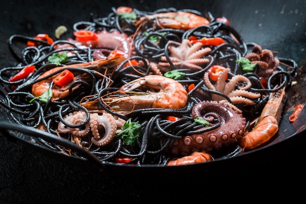 Tasty spaghetti with seafood made of octopus tiger prawns