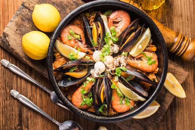 Tasty Spanish paella with seafood .