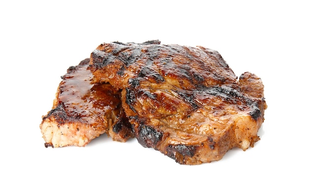 Tasty steaks on white background