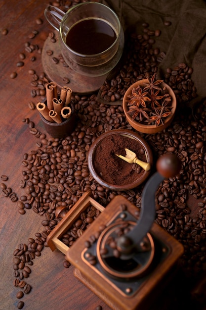 Tasty steaming espresso in cup with coffee beans View from above Dark background