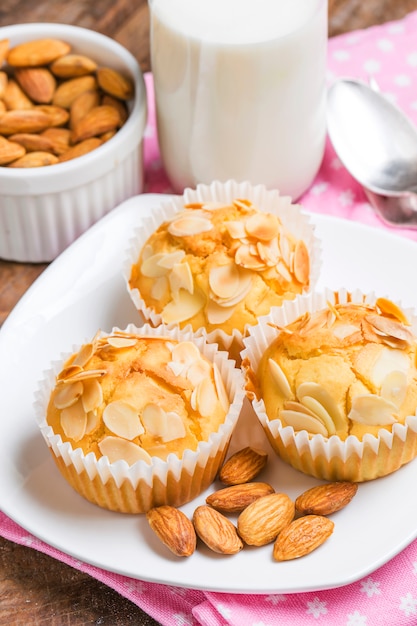 Tasty sugar muffins with almond and walnuts