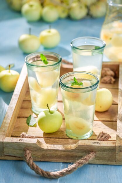 Tasty and sweet apple juice served in summer garden