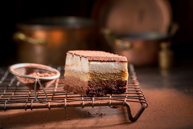 Tasty tiramisu cake made of mascarpone biscuits and cocoa