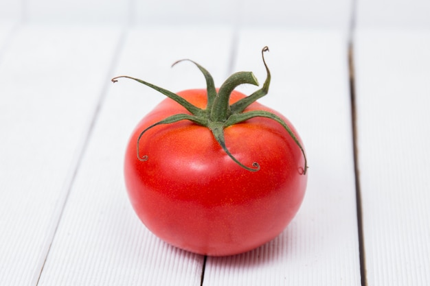 Tasty tomato on a white background