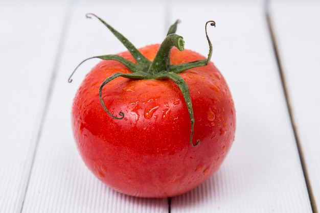 Tasty tomato on a white background