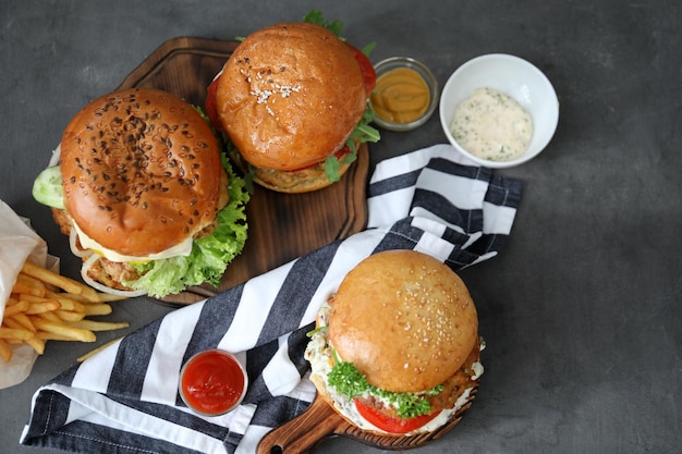 Tasty turkey burgers on table