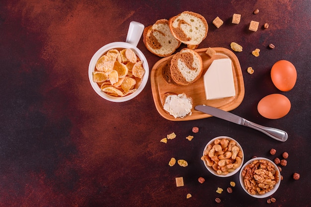 Tasty and useful breakfast with flakes, milk, nuts and dried fruits