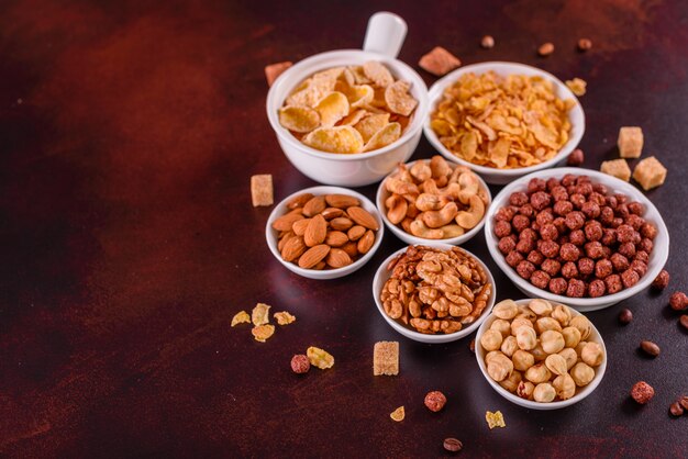 Tasty and useful breakfast with flakes, milk, nuts and dried fruits