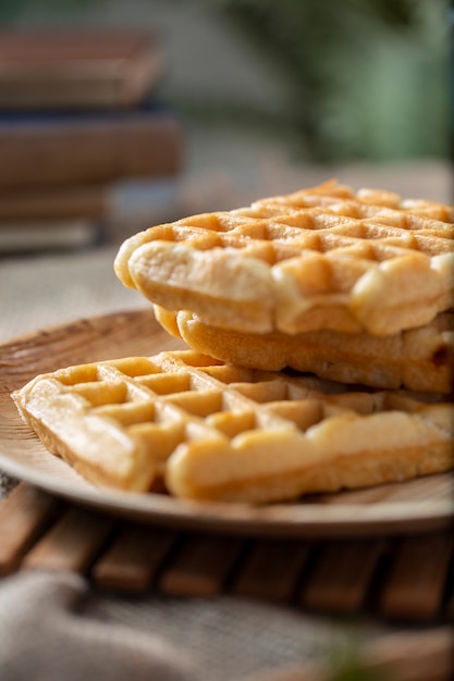 Tasty waffles on plate