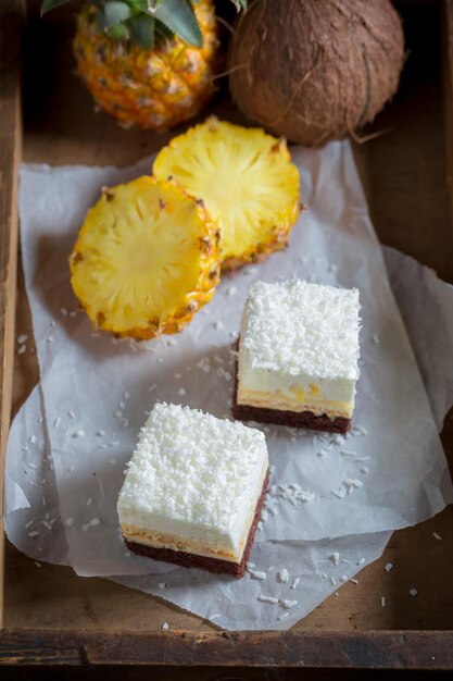 Tasty white cake made of cocoa biscuit and pineapple