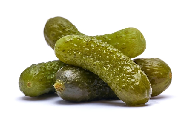 Tasty whole green cornichons isolated on a white background