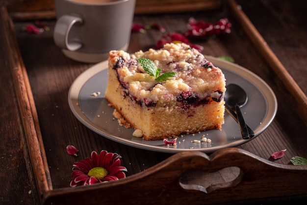 Tasty yeast cake with icing and fruits