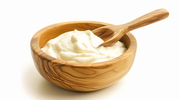 Tasty yoghurt in a wooden bowl isolated on a white background