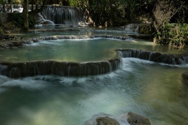 Tat Kwang Si Waterfall is a large waterfall, clear water and emerald green in Luang Prabang, Laos.