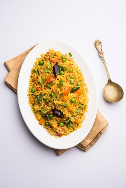 Tawa Pulao or Pulav or Pilaf or Pilau is an Indian Street Food  made using basmati rice, vegetables and spices. Selective focus