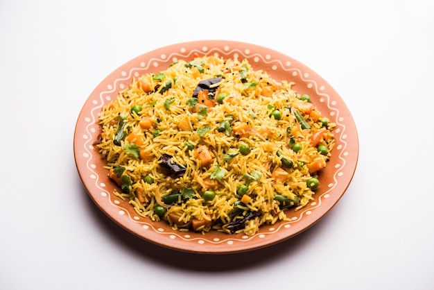 Tawa Pulao or Pulav or Pilaf or Pilau is an Indian Street Food  made using basmati rice, vegetables and spices. Selective focus