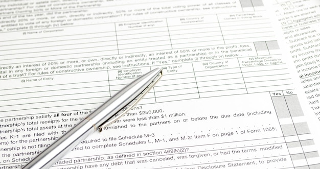 Tax forms and pen with calculator Tax concept