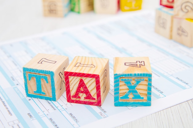 Tax written on wooden cubes