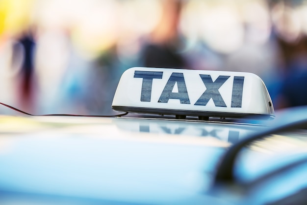 Taxi light on the cab of the car ready to transport the passengers