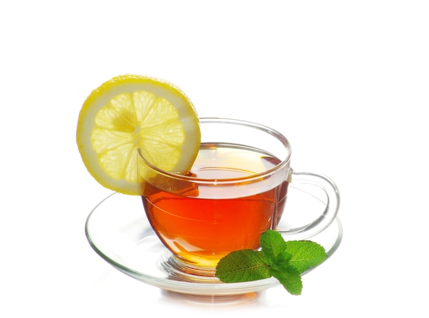 Tea being poured into glass tea cup