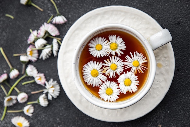 tea chamomile flowers healing hot drink healthy meal food snack on the table copy space food