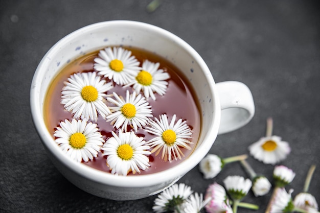 tea chamomile flowers healing hot drink healthy meal food snack on the table copy space food