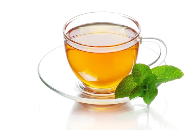 Tea in cup with leaf mint isolated on white background