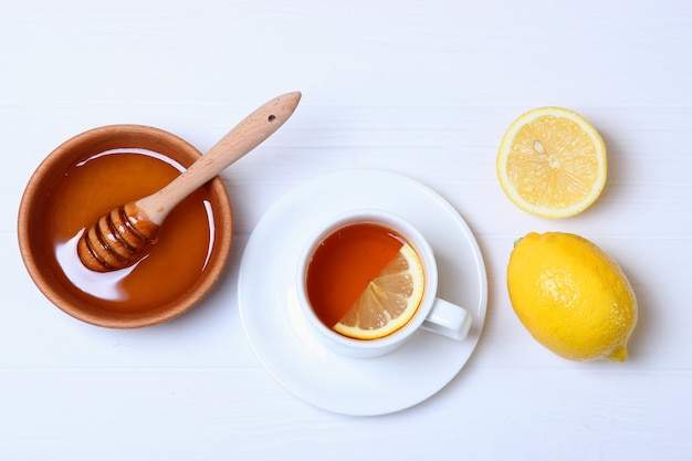 Tea honey and lemon on the table top view