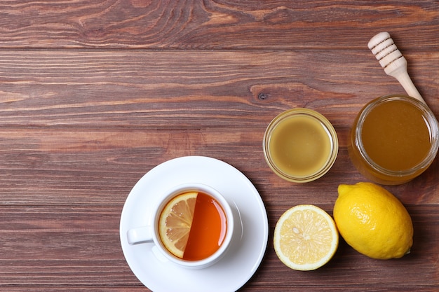 Tea honey and lemon on the table top view