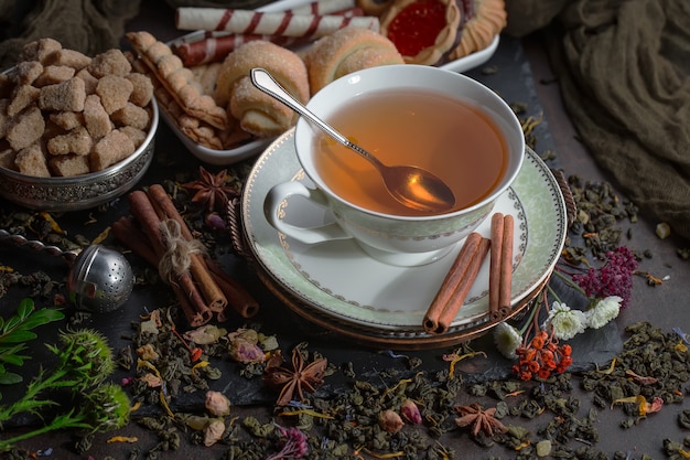 Tea hot drink on old background in composition on the table