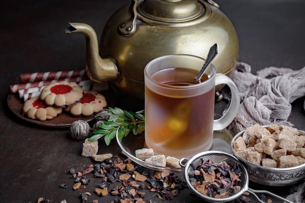 Tea hot drink on old background in composition on the table