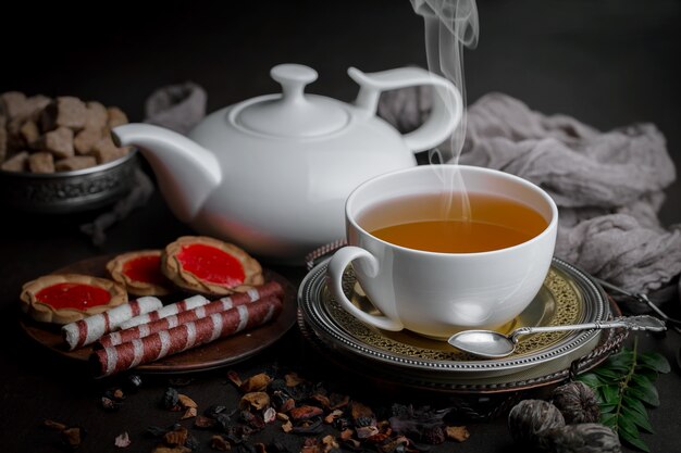 Tea hot drink on old background in composition on the table