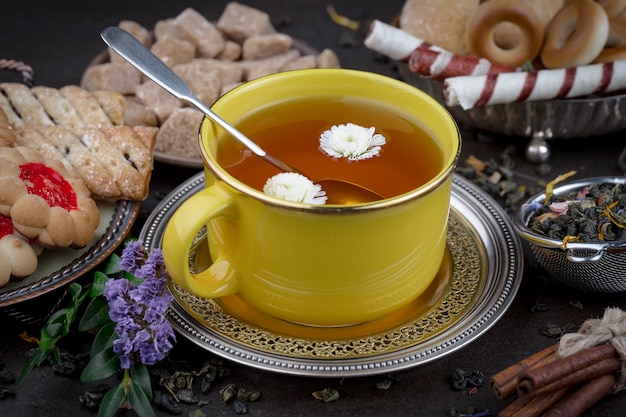 Tea hot drink on old background in composition on the table