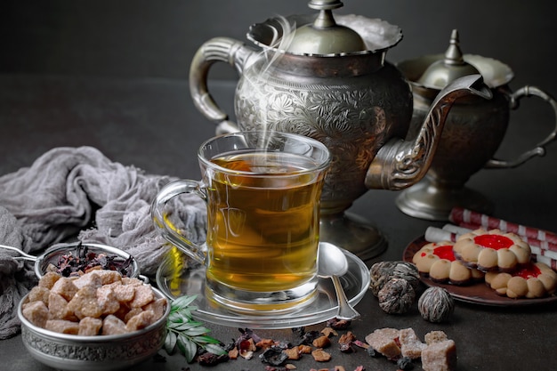 Tea hot drink on old background in composition on the table