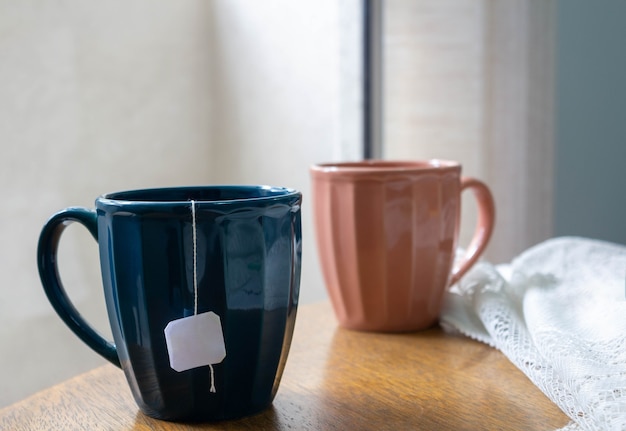 Tea mugs on wooden table