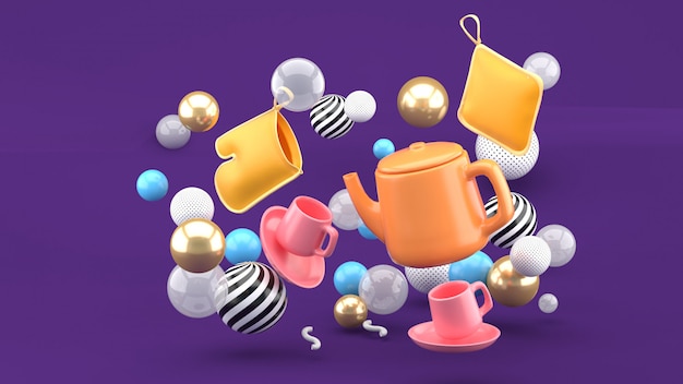 A tea set amid colorful balls on a purple space