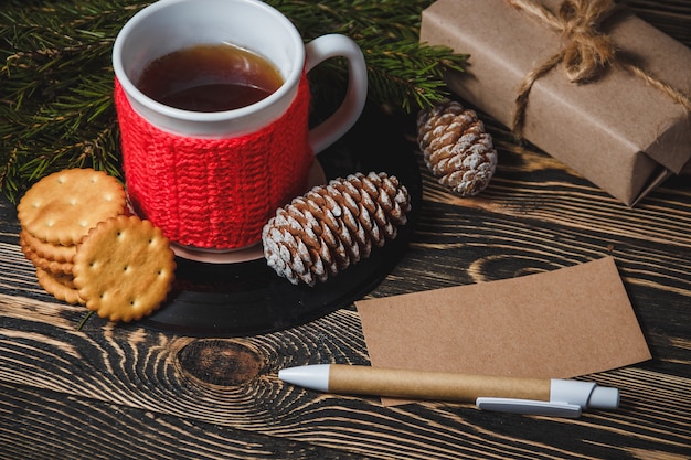 Tea in white cup and Christmas decor