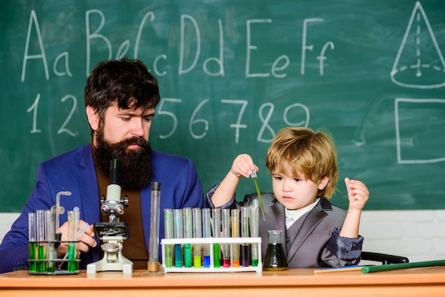 Teacher bearded scientist man child test tubes Chemical experiment Genius child private lesson Knowledge day Genius minds Special and unique Genius kid Joys and challenges raising gifted child