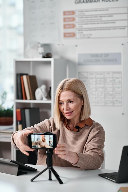 Teacher connecting smartphone for online lesson