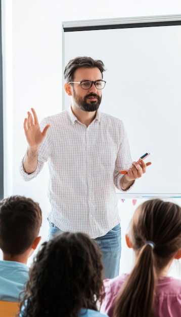 Teacher Standing in Front of Whiteboard