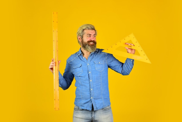 Teacher stem Measuring centimeters School education Free education Teaching geometry Long or short Bearded man use ruler Education concept School classes Studying with fun Measurement tool