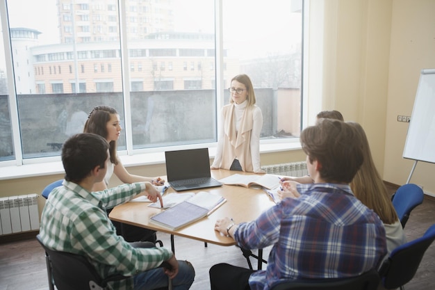 Teacher with college students in class