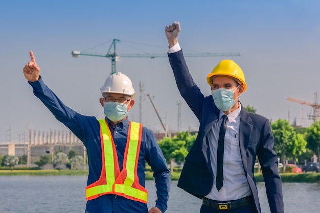 Team Asian man architect on a building construction site